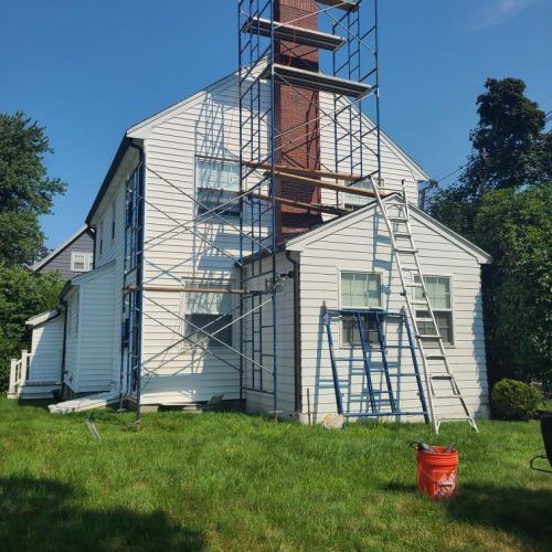 white house getting siding installation