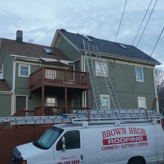 brown bros roofing truck parked at home roofing installation project